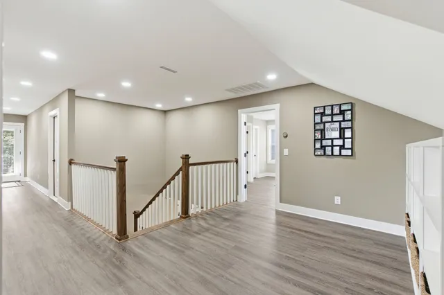 a bathroom with a granite countertop sink toilet and a mirror