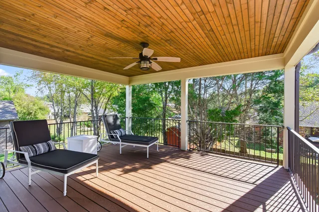 a front view of a house with a garden and plants