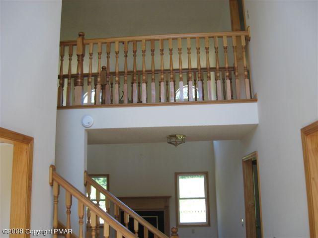 5791 Clover Road Long Pond, PA 18334 - Photo 6 of 8 a view of staircase with railing and a window