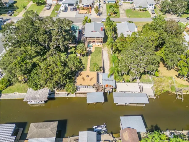 an aerial view of residential house with outdoor space and lake view