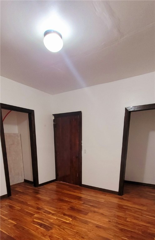 809 Hickey Street Alice, TX 78332 - Photo 9 of 13 a view of an empty room with wooden floor and closet