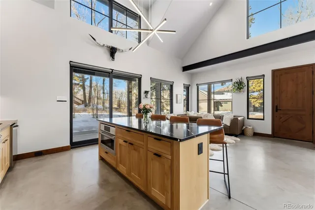 a kitchen with stainless steel appliances granite countertop a sink and cabinets