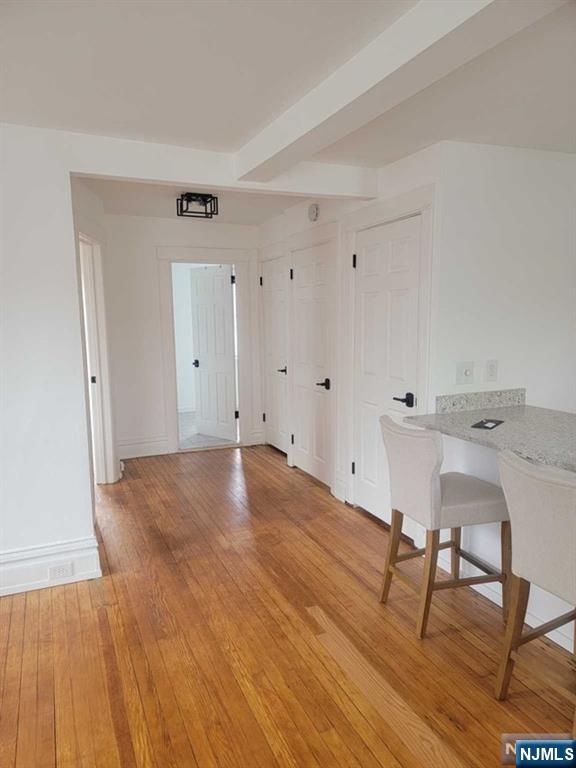 139 Union Place, Unit 2 Ridgefield Park, NJ 07660 - Photo 11 of 14 a view of empty room with wooden floor and chair