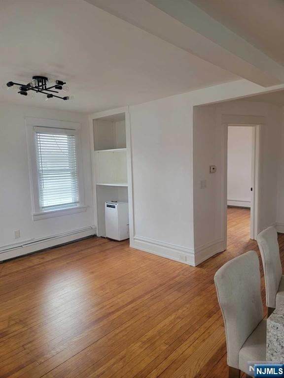 139 Union Place, Unit 2 Ridgefield Park, NJ 07660 - Photo 13 of 14 a view of a livingroom with furniture and wooden floor
