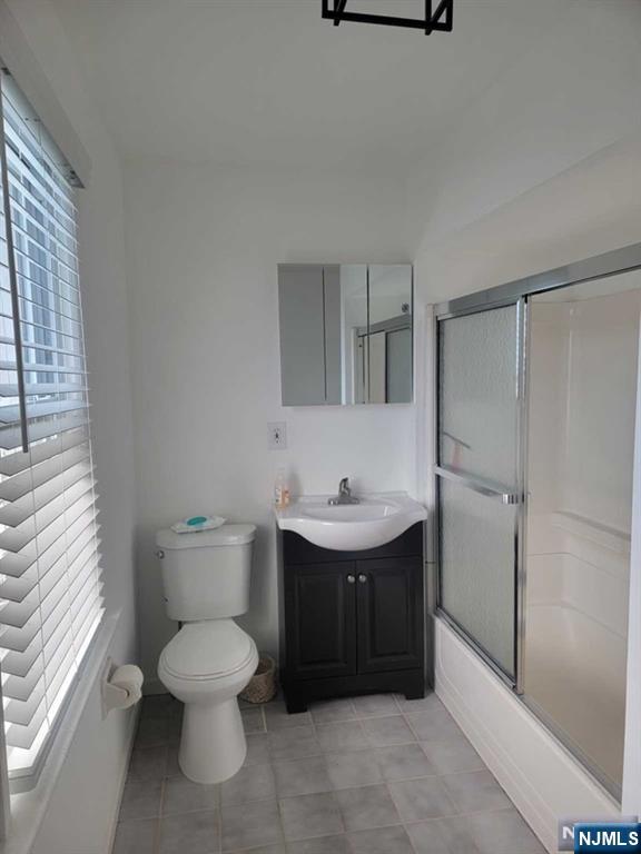139 Union Place, Unit 2 Ridgefield Park, NJ 07660 - Photo 14 of 14 a bathroom with a toilet sink and mirror