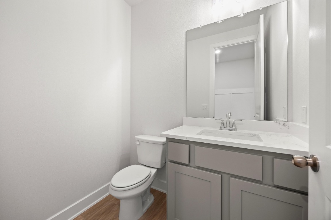 201 Buckaroo Drive Georgetown, TX 78633 - Photo 16 of 36 a bathroom with a toilet sink and mirror