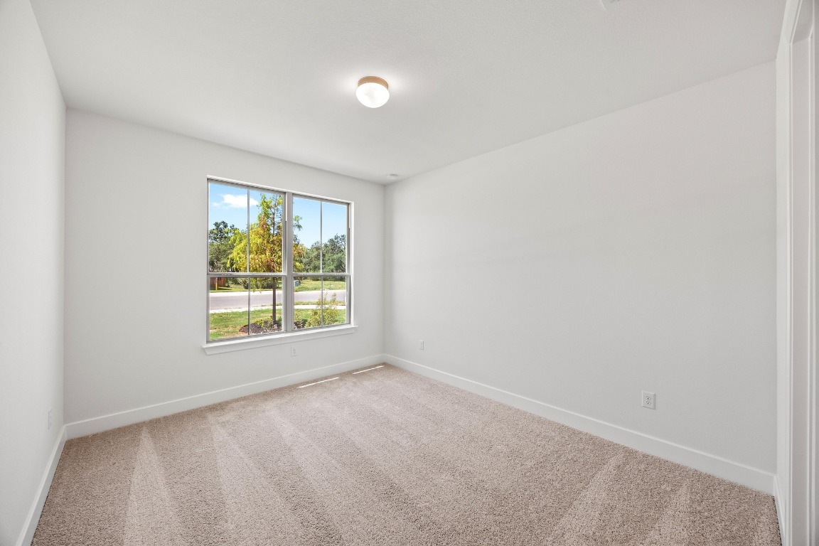 201 Buckaroo Drive Georgetown, TX 78633 - Photo 17 of 36 an empty room with a window