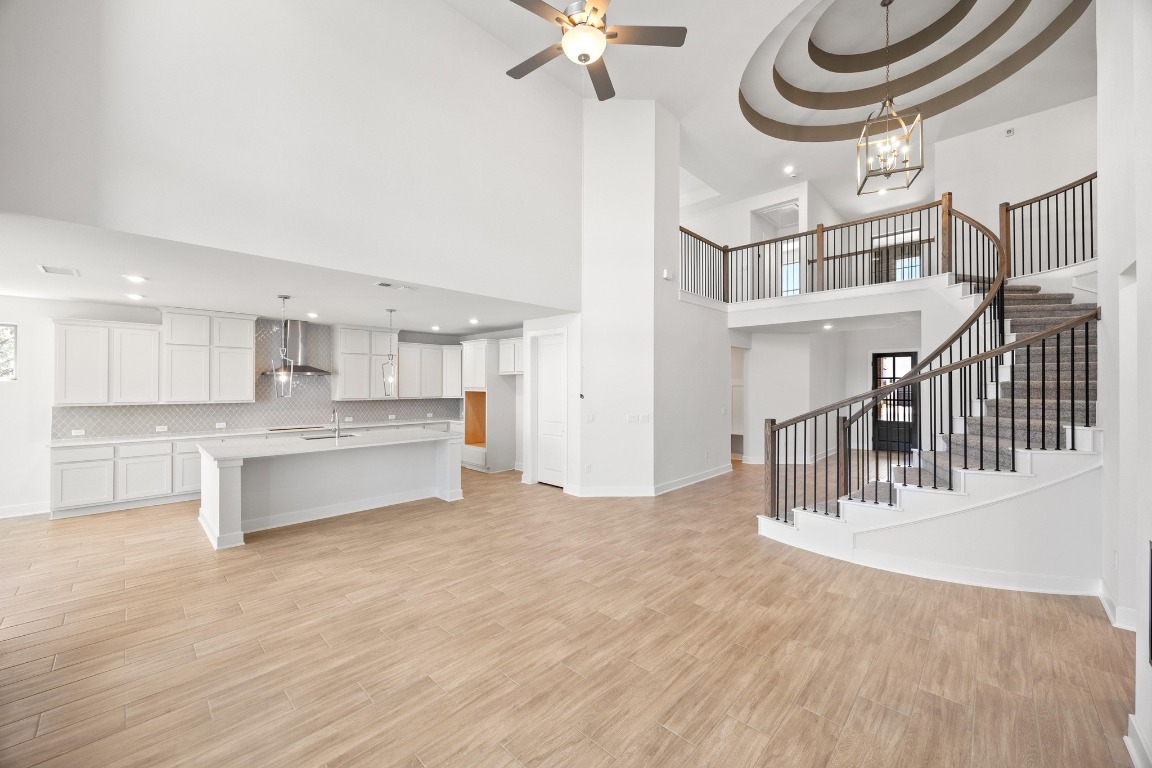 201 Buckaroo Drive Georgetown, TX 78633 - Photo 4 of 36 a view of kitchen and living room with wooden floor