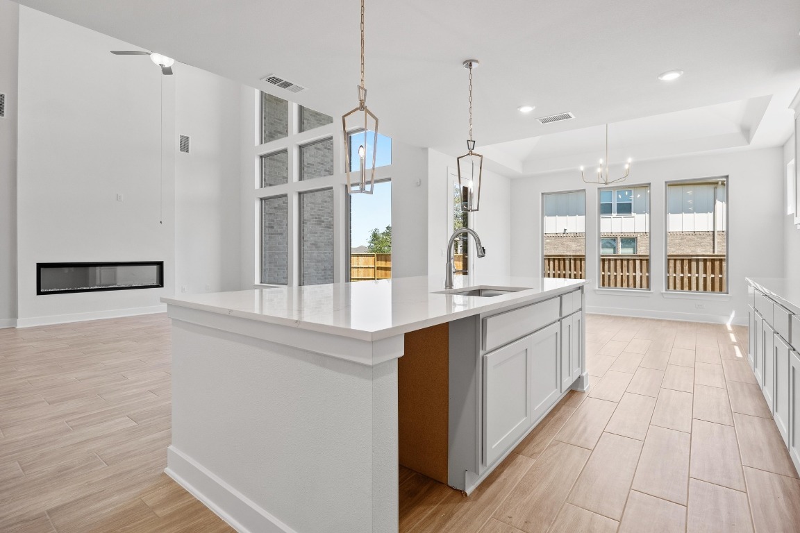 201 Buckaroo Drive Georgetown, TX 78633 - Photo 7 of 36 a large white kitchen with a large window