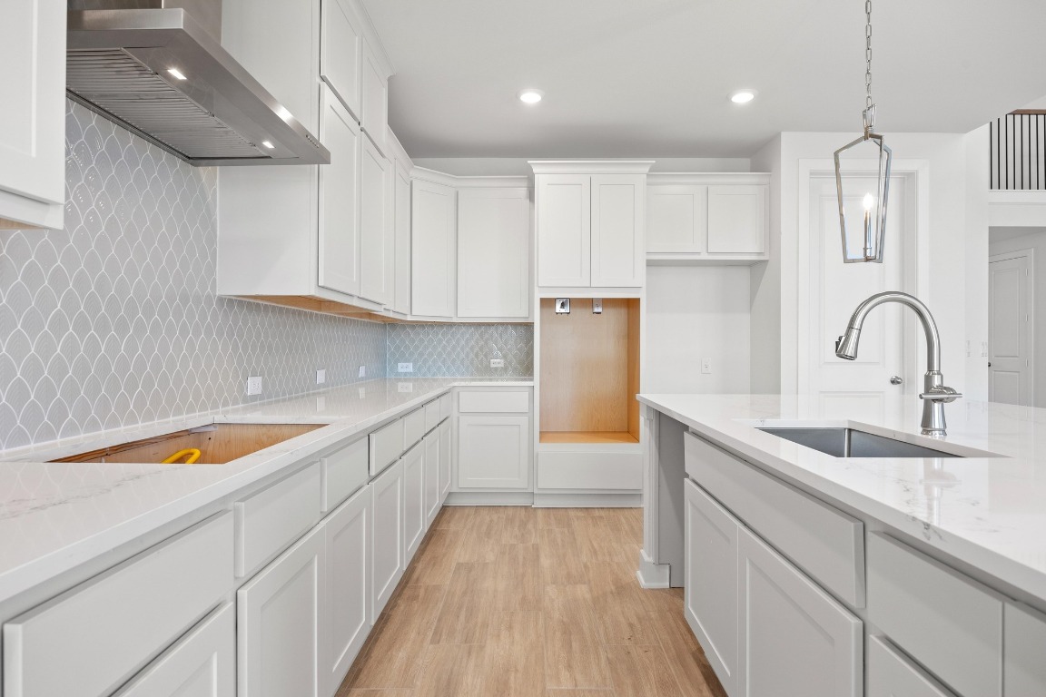 201 Buckaroo Drive Georgetown, TX 78633 - Photo 8 of 36 a kitchen with stainless steel appliances granite countertop a sink stove and refrigerator