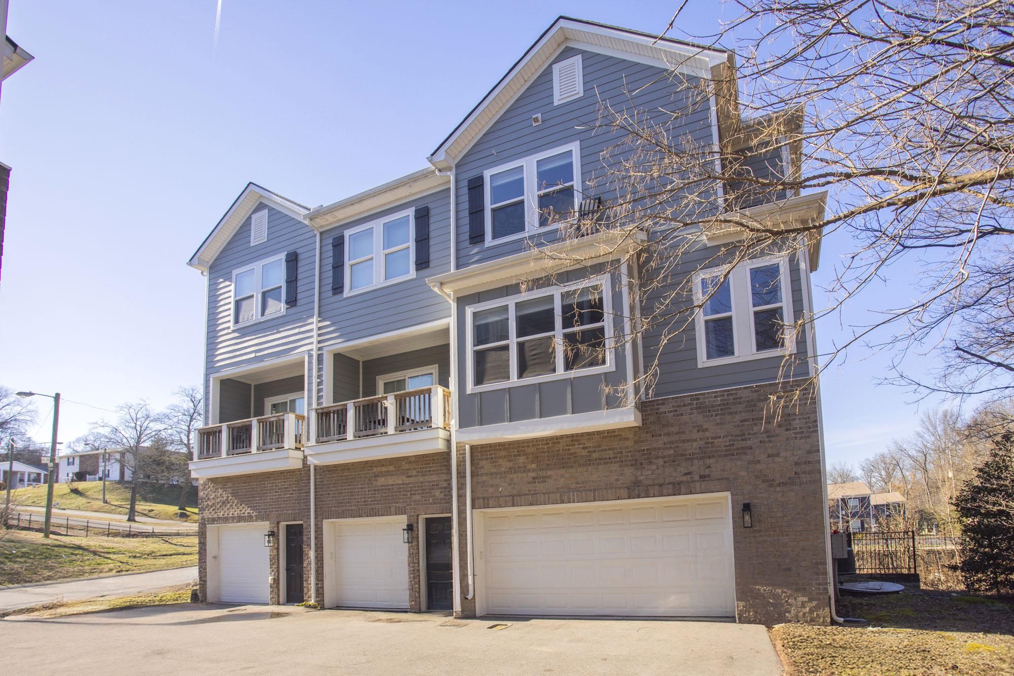 450 Glastonbury Road, Unit 3 Nashville, TN 37217 - Photo 1 of 43 a front view of a building with a garden