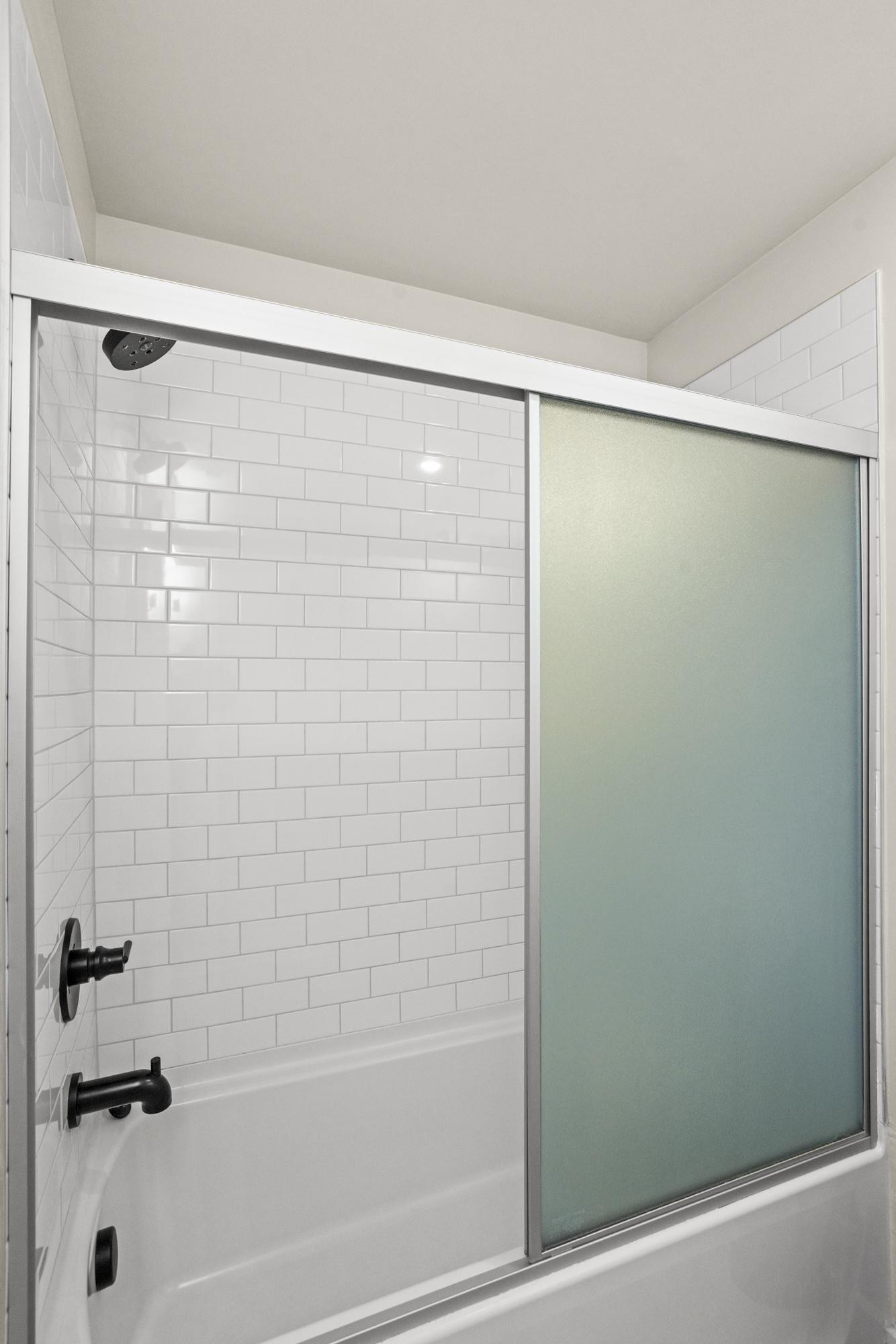 450 Glastonbury Road, Unit 3 Nashville, TN 37217 - Photo 15 of 43 a bathroom with a shower and a bath tub