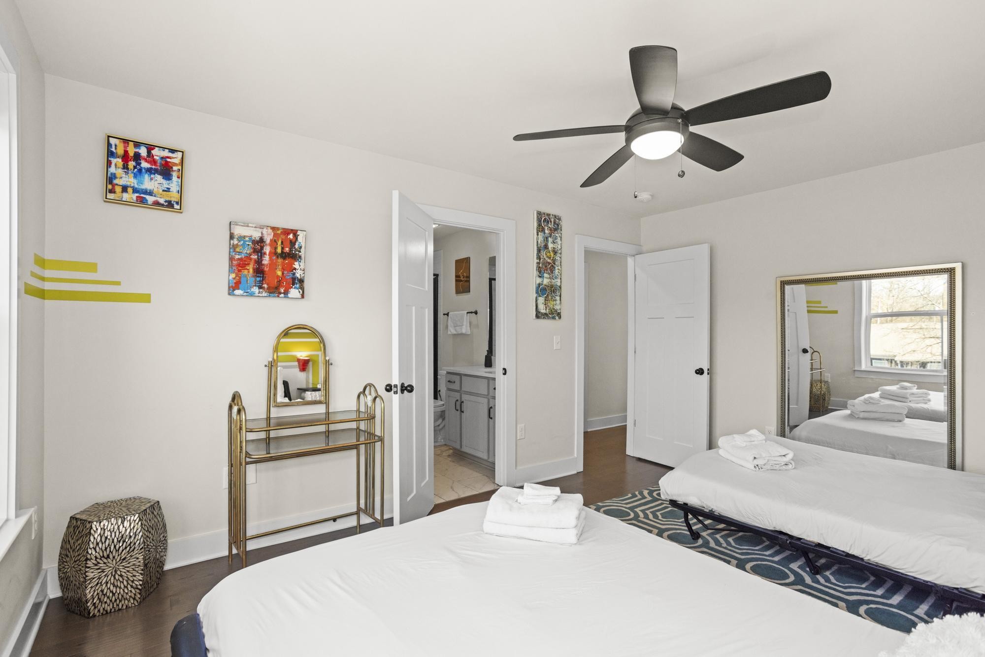 450 Glastonbury Road, Unit 3 Nashville, TN 37217 - Photo 20 of 43 a bedroom with a bed and a chandelier