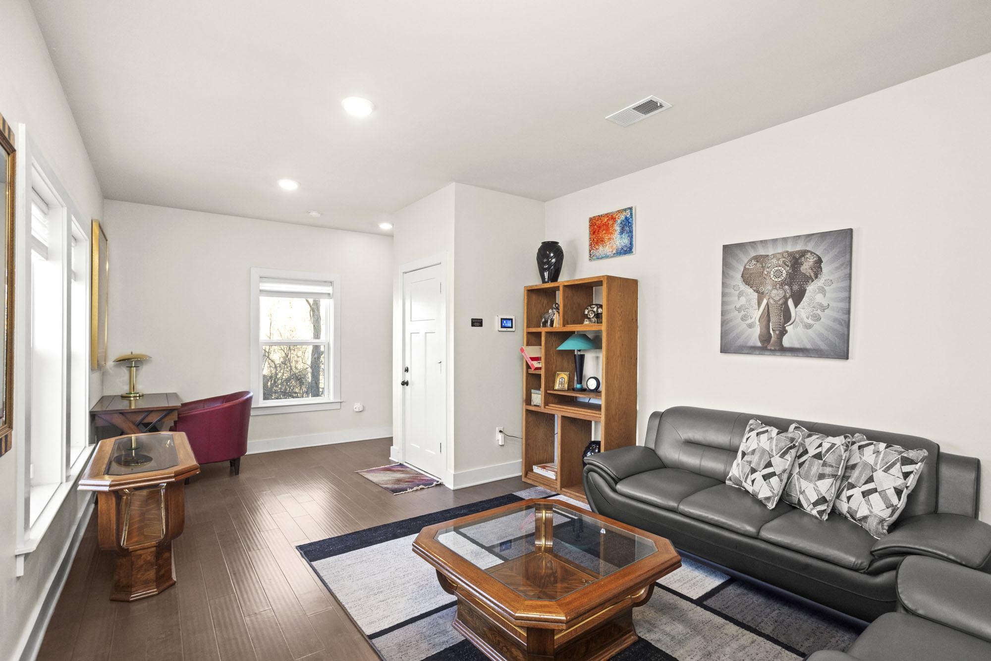 450 Glastonbury Road, Unit 3 Nashville, TN 37217 - Photo 5 of 43 a living room with furniture and a wooden floor