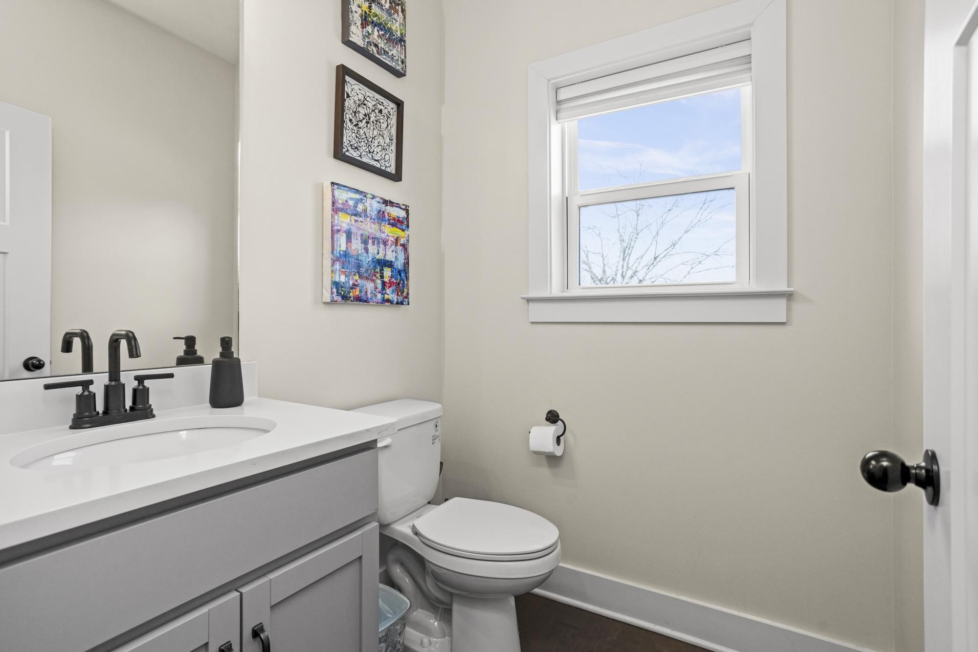 450 Glastonbury Road, Unit 3 Nashville, TN 37217 - Photo 7 of 43 a bathroom with a toilet sink and mirror