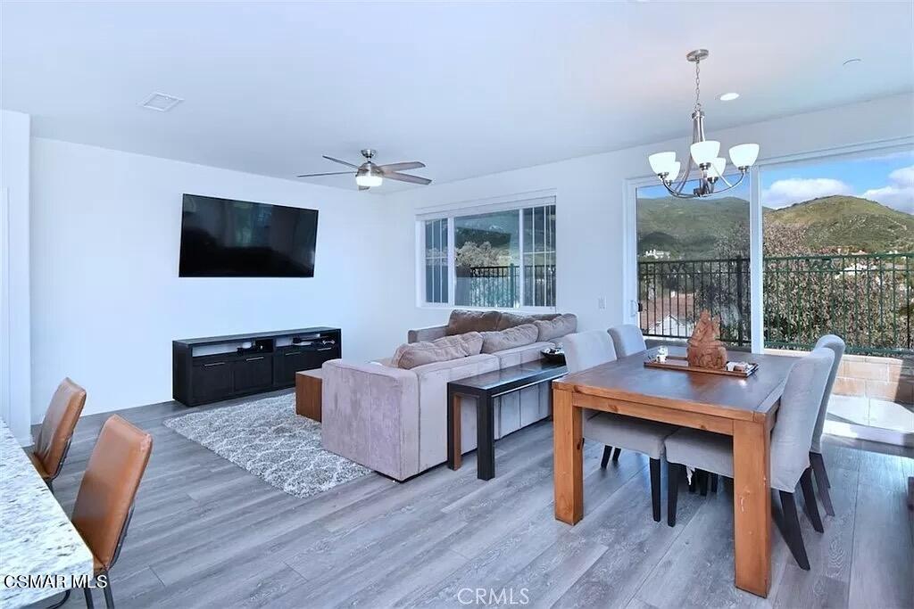 207 Morro Way, Unit 3 Simi Valley, CA 93065 - Photo 2 of 31 a living room with furniture a flat screen tv and a large window