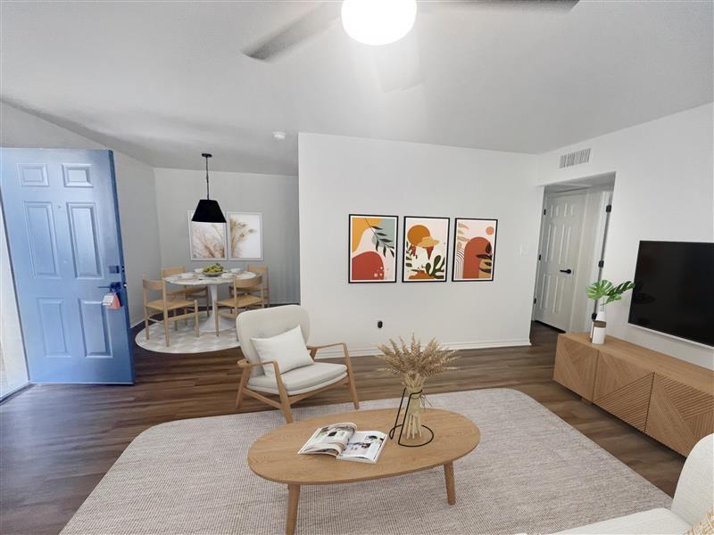 4639 Williams Road, Unit 107 Benbrook, TX 76116 - Photo 3 of 11 Living room featuring wood finished floors and baseboards