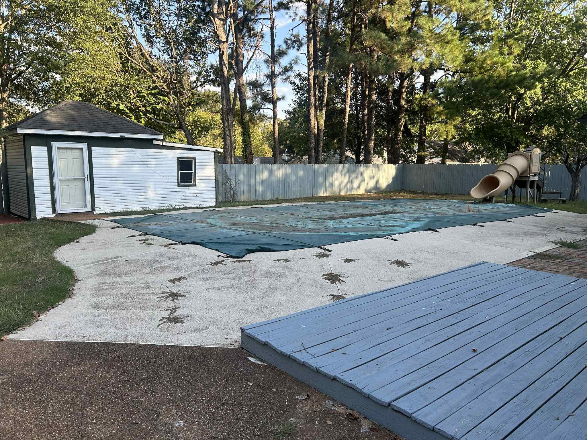 1012 Hunters Point Drive Memphis, TN 38018 - Photo 7 of 10 a view of a backyard with large trees