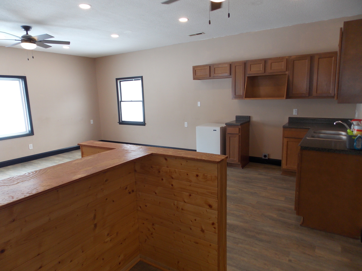 303 West Poplar Street Odin, IL 62870 - Photo 18 of 20 a kitchen with a refrigerator and a stove top oven
