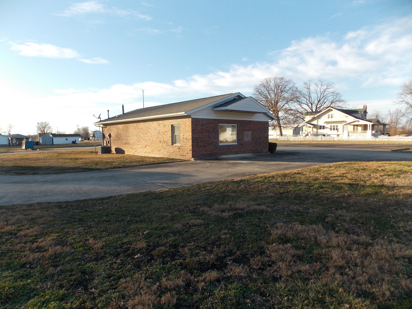 303 West Poplar Street Odin, IL 62870 - Photo 6 of 20 a view of big yard next to a house with large trees