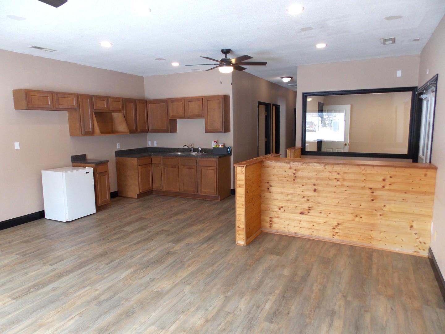 303 West Poplar Street Odin, IL 62870 - Photo 8 of 20 a large kitchen with kitchen island a sink stainless steel appliances and cabinets
