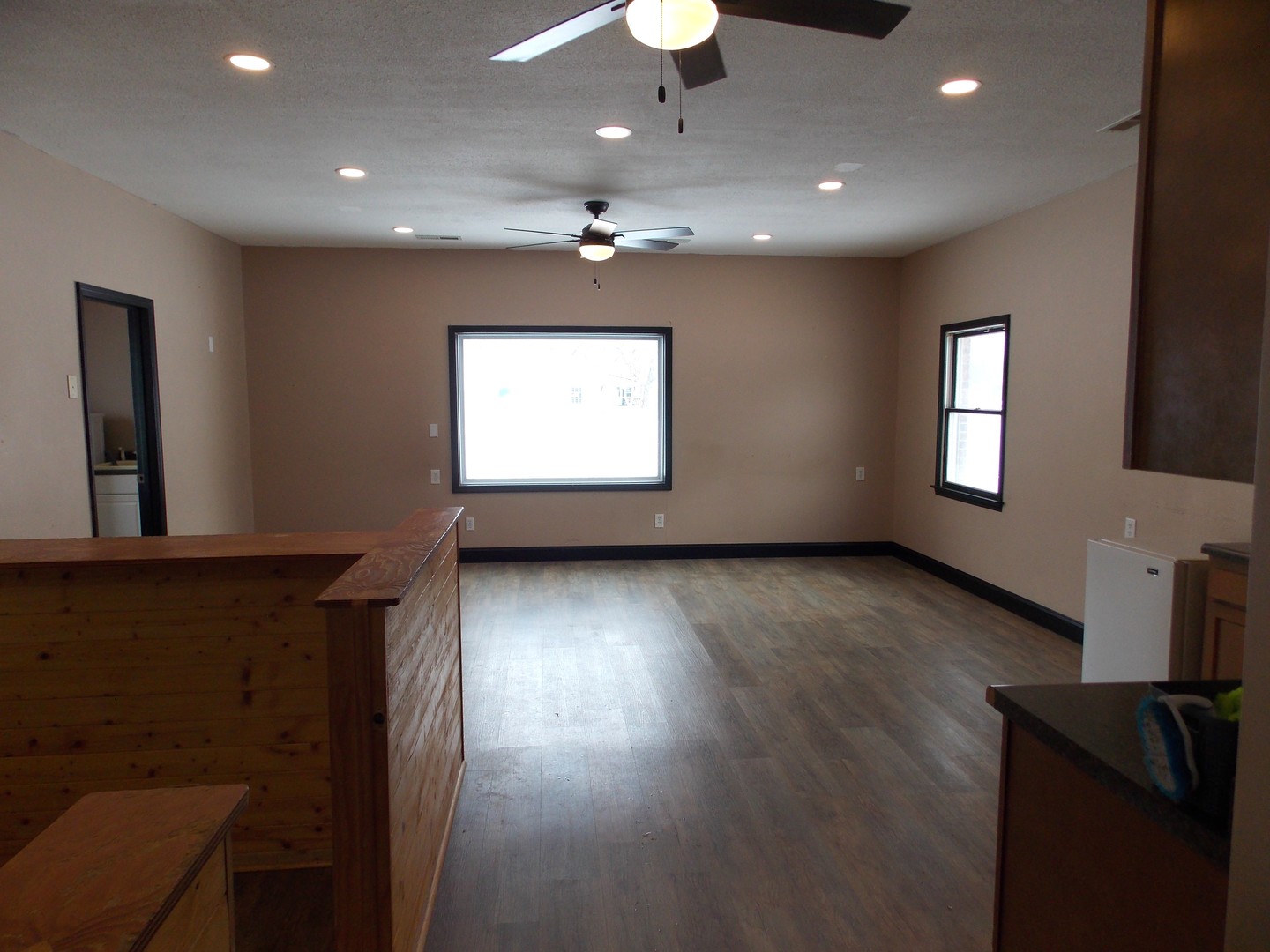 303 West Poplar Street Odin, IL 62870 - Photo 10 of 20 a view of an empty room with a window and wooden floor
