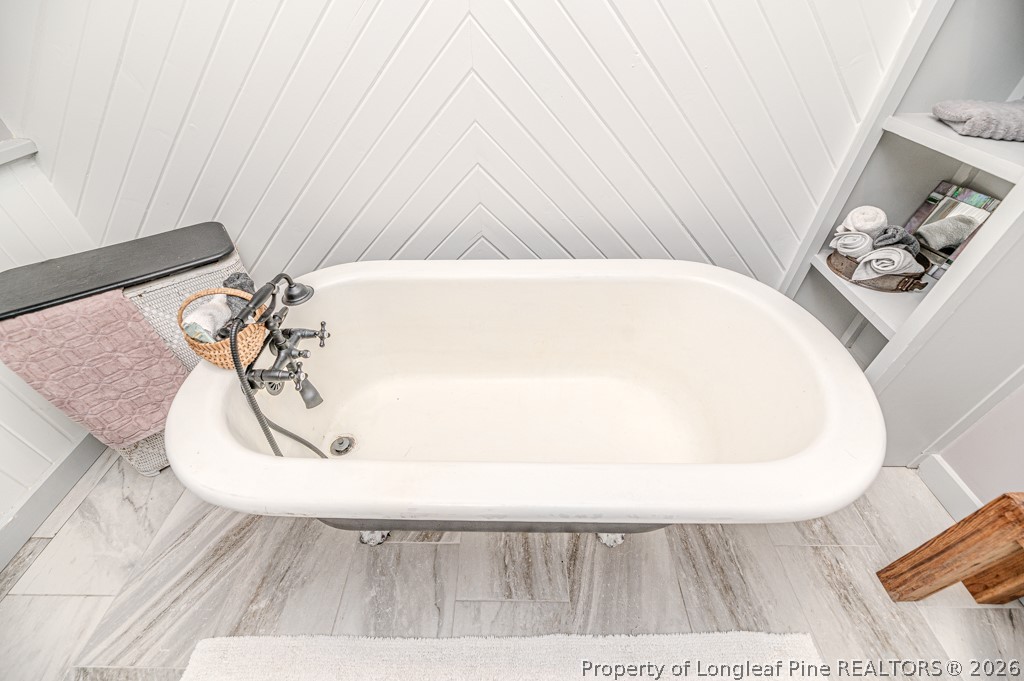 509 Carthage Street Cameron, NC 28326 - Photo 23 of 43 a view of a bathtub in a bathroom