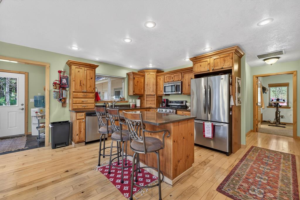 31 Eagle Trail Cascade, ID 83611 - Photo 11 of 50 The Kitchen, With Granite, Stainless, Alder cabinets and hickory floors.