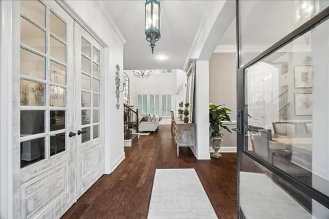 a view of a living room and wooden floor