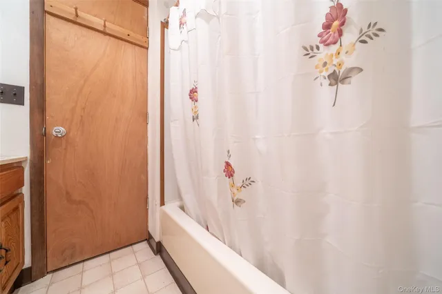 a bathroom with a shower curtain