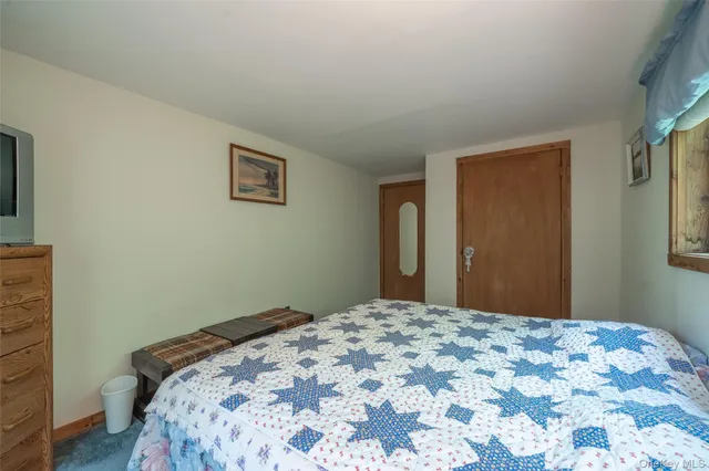 a bedroom with a bed and a cabinets