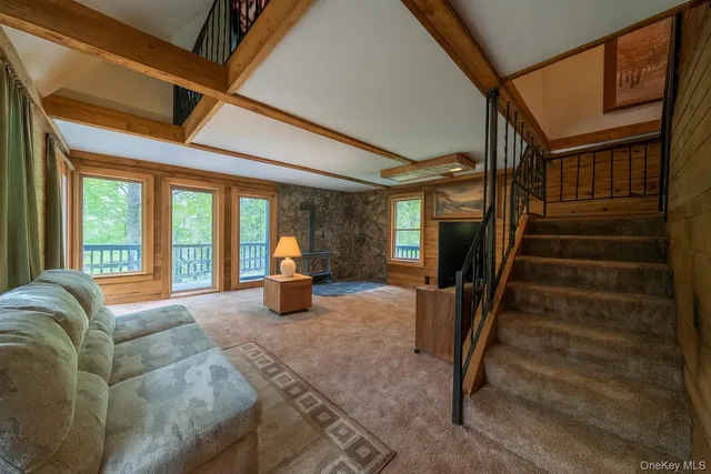 a view of living room with furniture and staircase