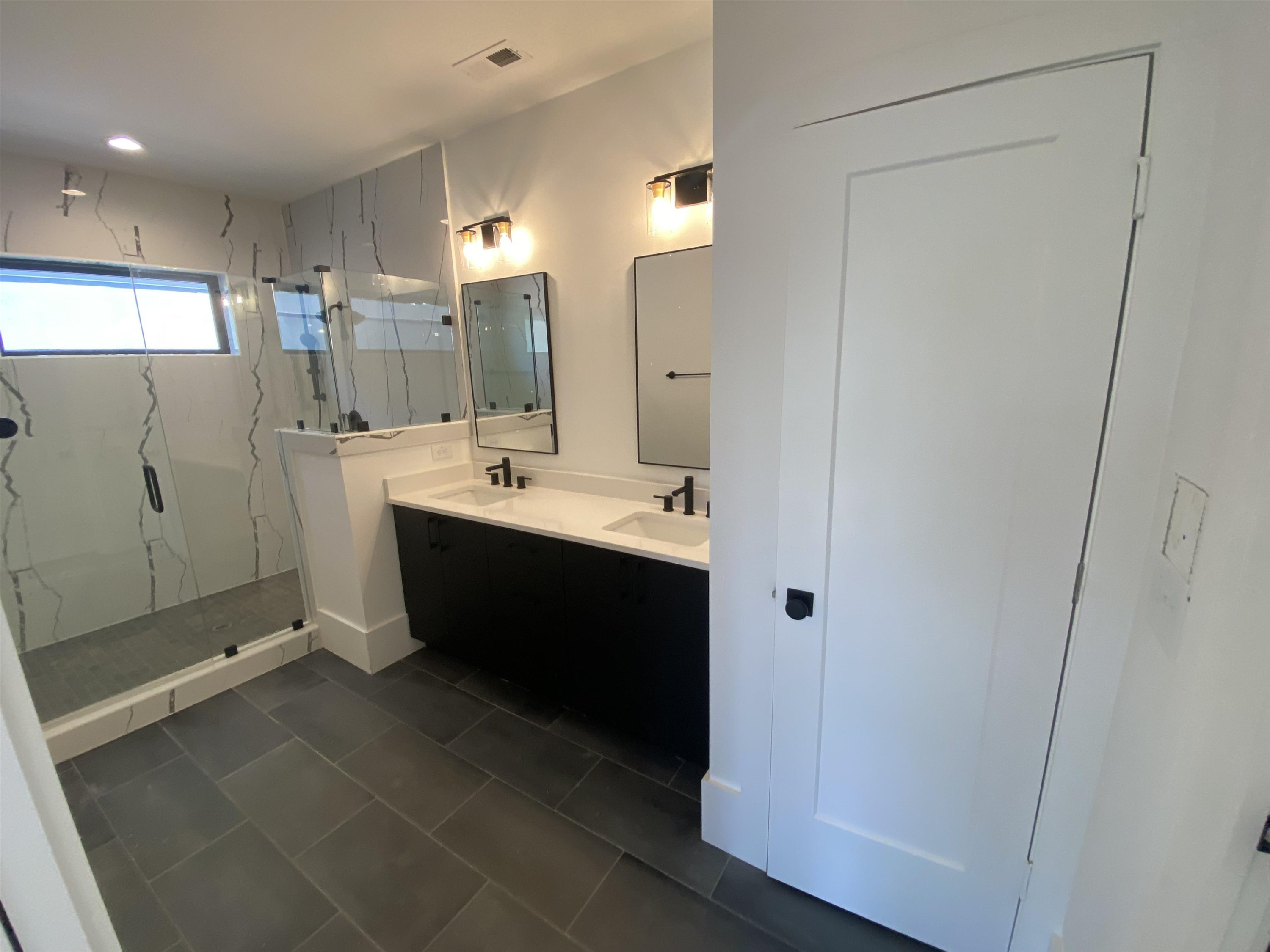 705 Chamberlain Street Raleigh, NC 27607 - Photo 8 of 10 a room with a mirror and a sink