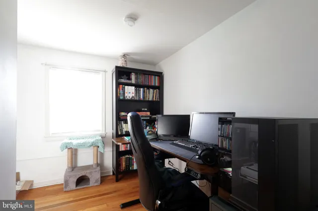 a workspace with furniture hardwood and a window