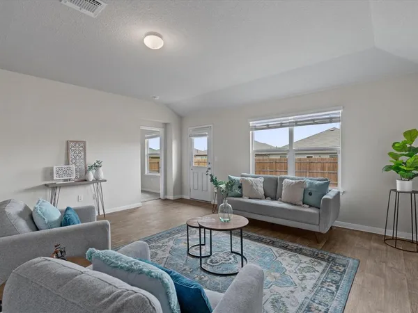 a living room with furniture and a table