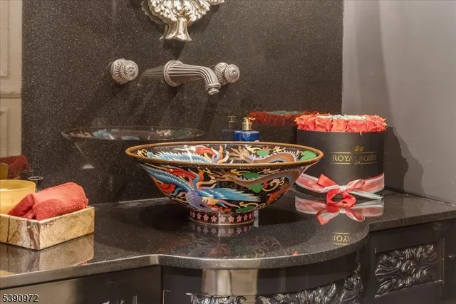 a outdoor dining table with chairs and chandelier