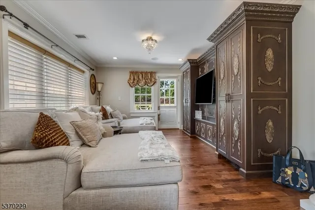 a living room with furniture fireplace and flat screen tv