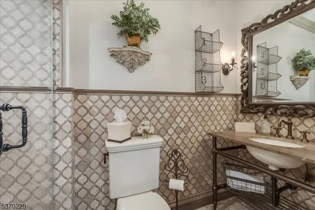 a bathroom with a toilet and a sink