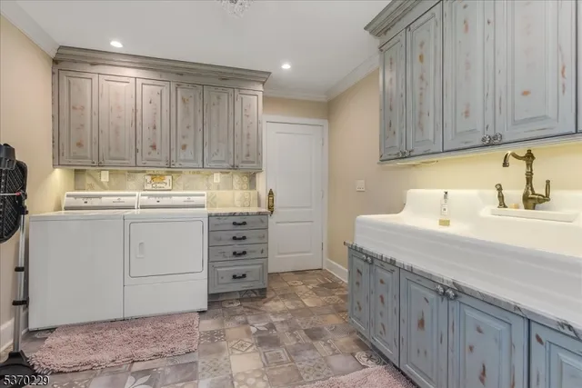 a kitchen with cabinets appliances and a sink