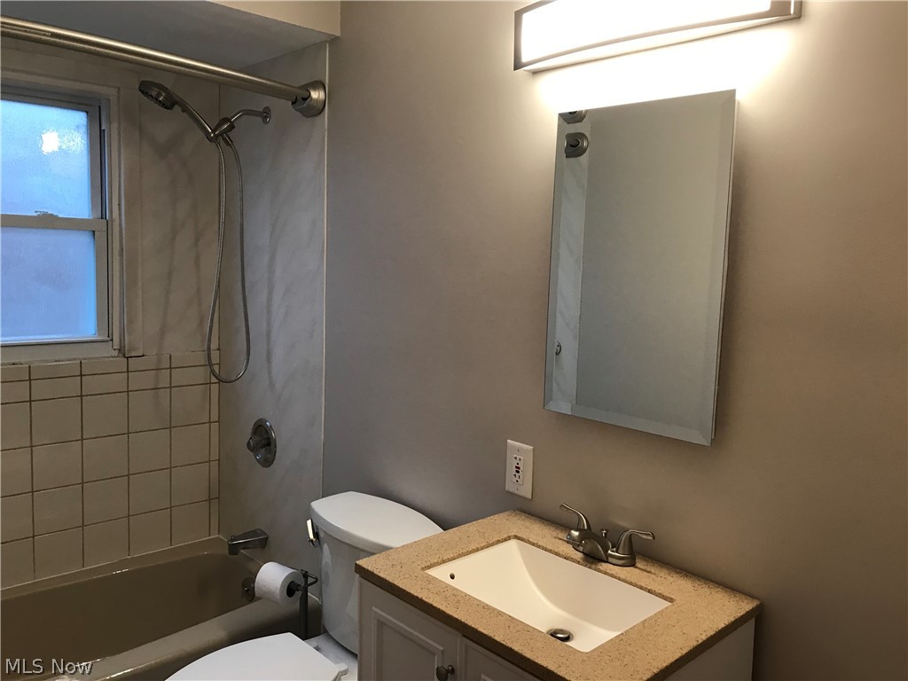 6564 Ridgewood Lakes Drive Parma, OH 44129 - Photo 23 of 33 Main bath with tile shower, newer med cabinet and lighting