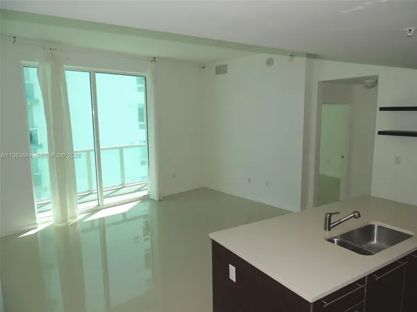 a bathroom with a sink a vanity and a window