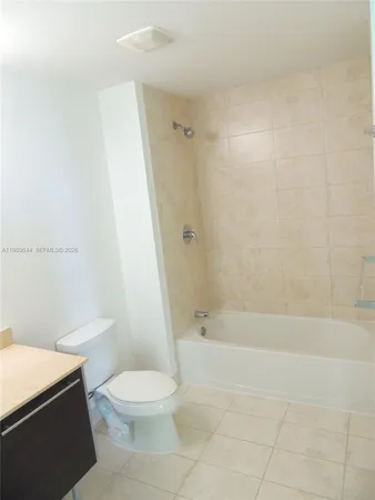 a bathroom with a toilet and shower