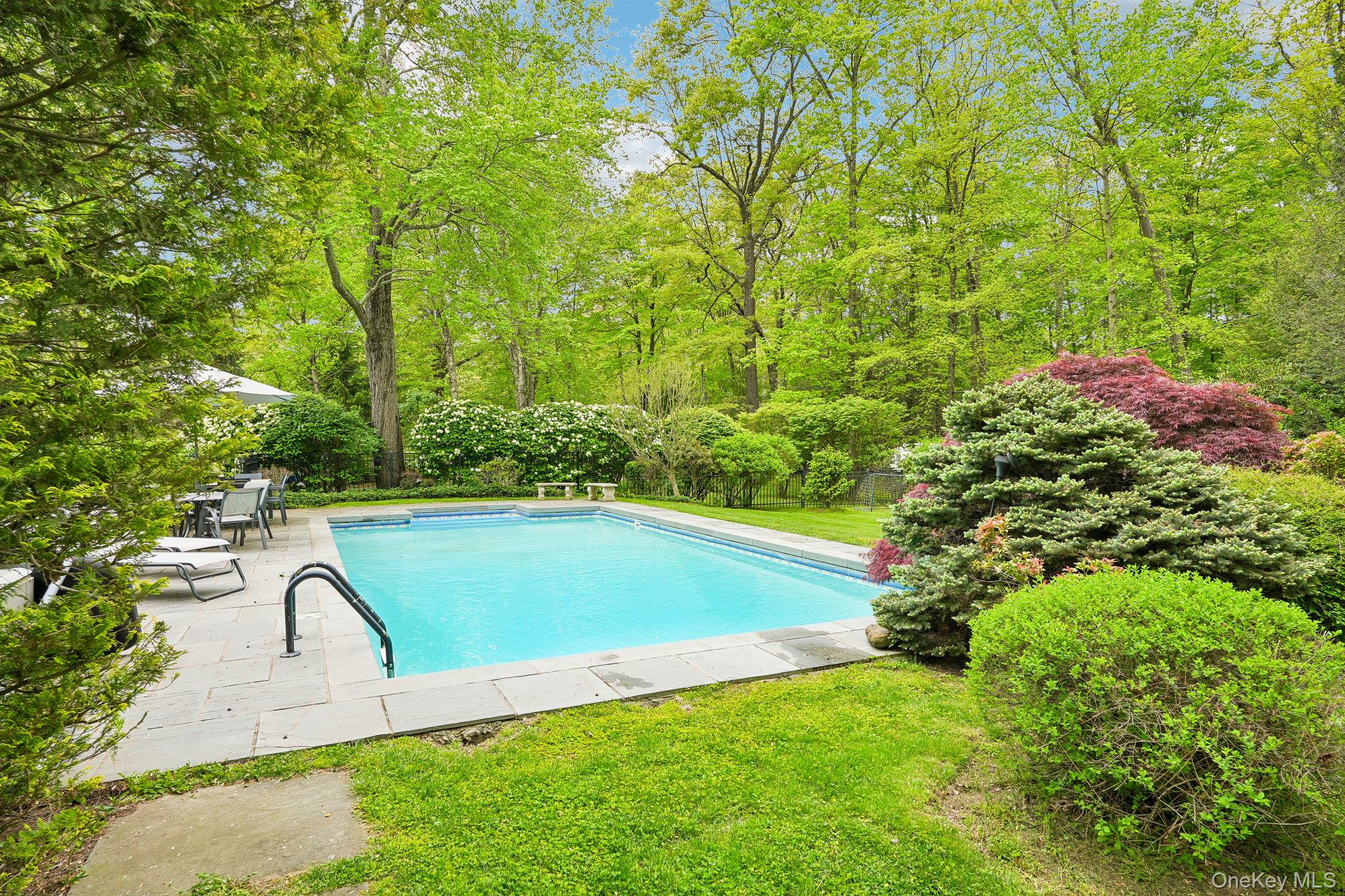 27 Cat Ridge Road North Salem, NY 10560 - Photo 10 of 49 a view of swimming pool with seating area and green space
