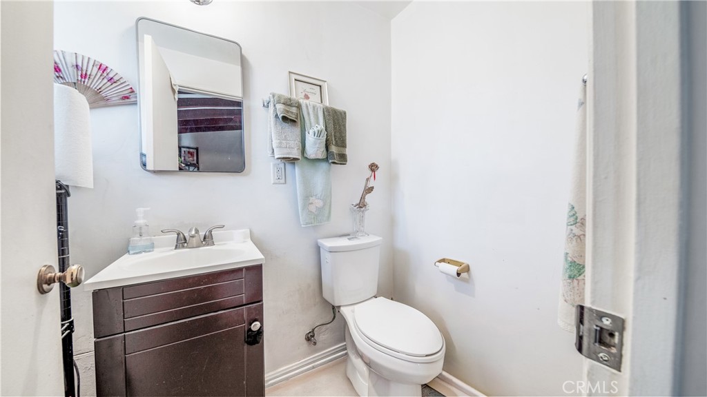 1549 Elizabeth Lake Road Palmdale, CA 93551 - Photo 12 of 27 a bathroom with a sink toilet vanity and mirror