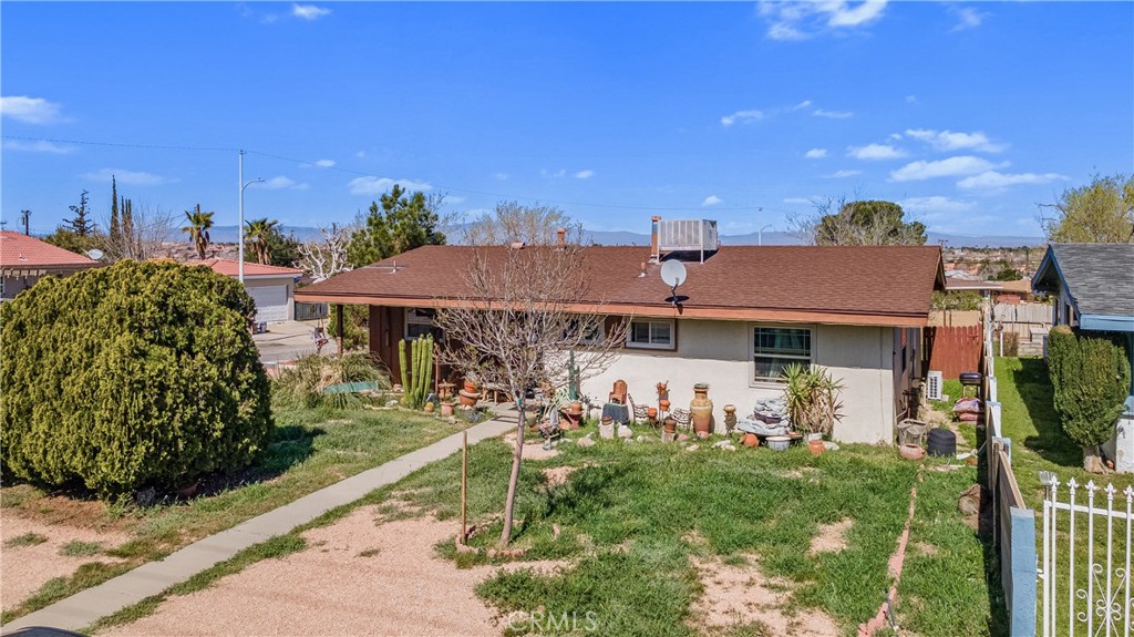 1549 Elizabeth Lake Road Palmdale, CA 93551 - Photo 2 of 27 a front view of a house with garden