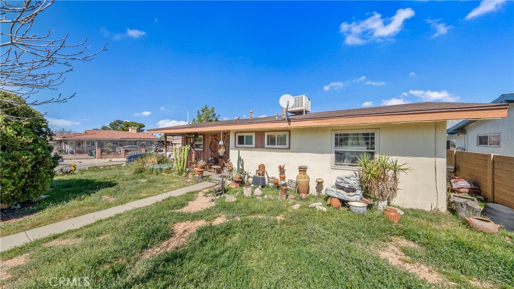 1549 Elizabeth Lake Road Palmdale, CA 93551 - Photo 3 of 27 a front view of house with yard and seating area