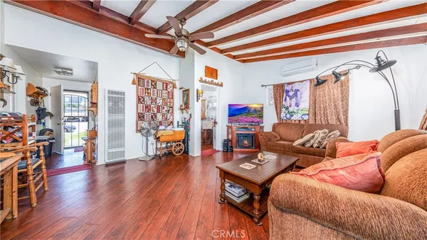 a living room with lots of furniture and a rug