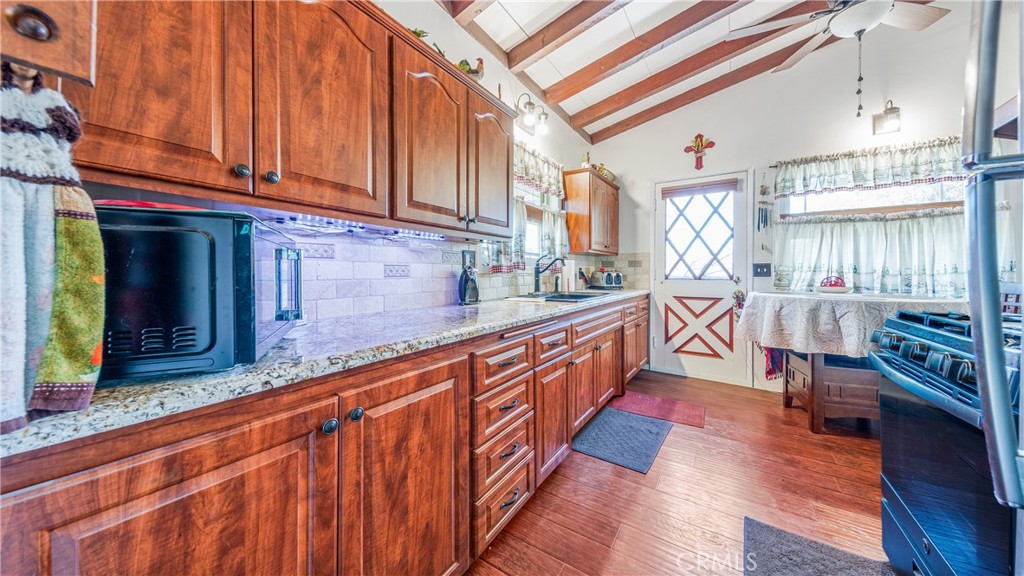 1549 Elizabeth Lake Road Palmdale, CA 93551 - Photo 8 of 27 a view of a kitchen with car parked
