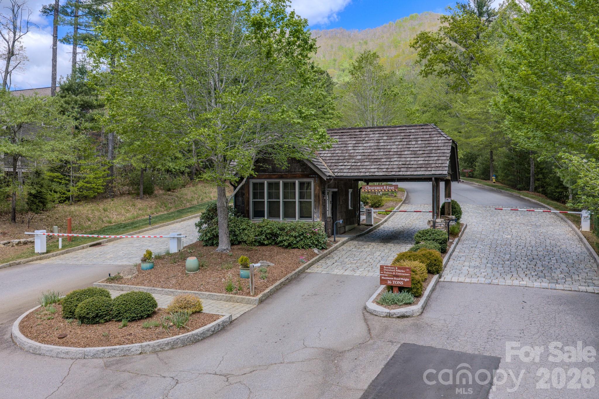 67 Clear Water Trail Road, Unit 511 Fairview, NC 28730 - Photo 2 of 12 a backyard of a house with yard fire pit and outdoor seating