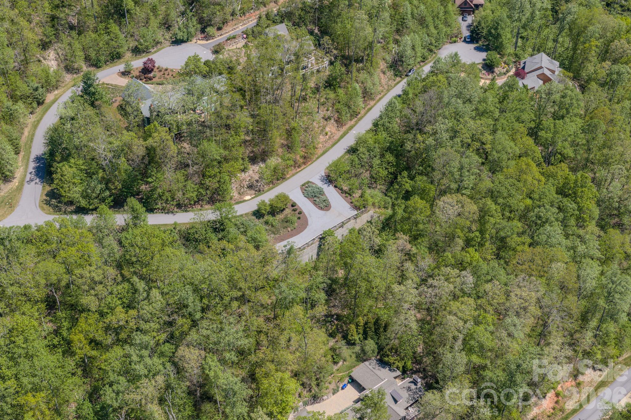 67 Clear Water Trail Road, Unit 511 Fairview, NC 28730 - Photo 3 of 12 a aerial view of a house with a yard and outdoor seating